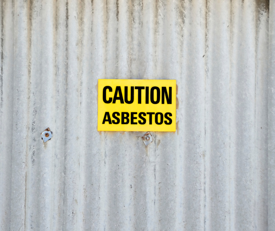 Wall with 'caution asbestos' sign