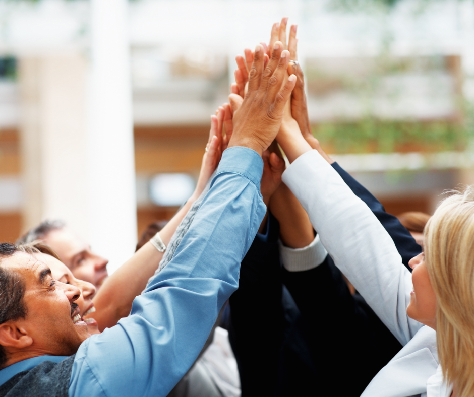 Group of people high-fiving