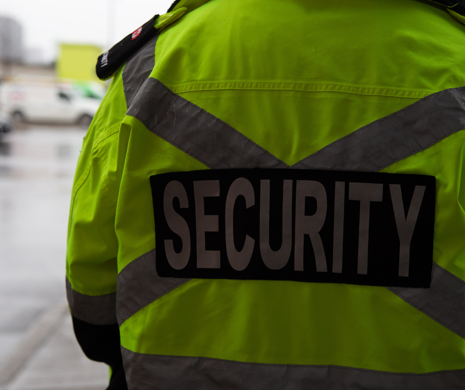 Back of someone wearing a security jacket